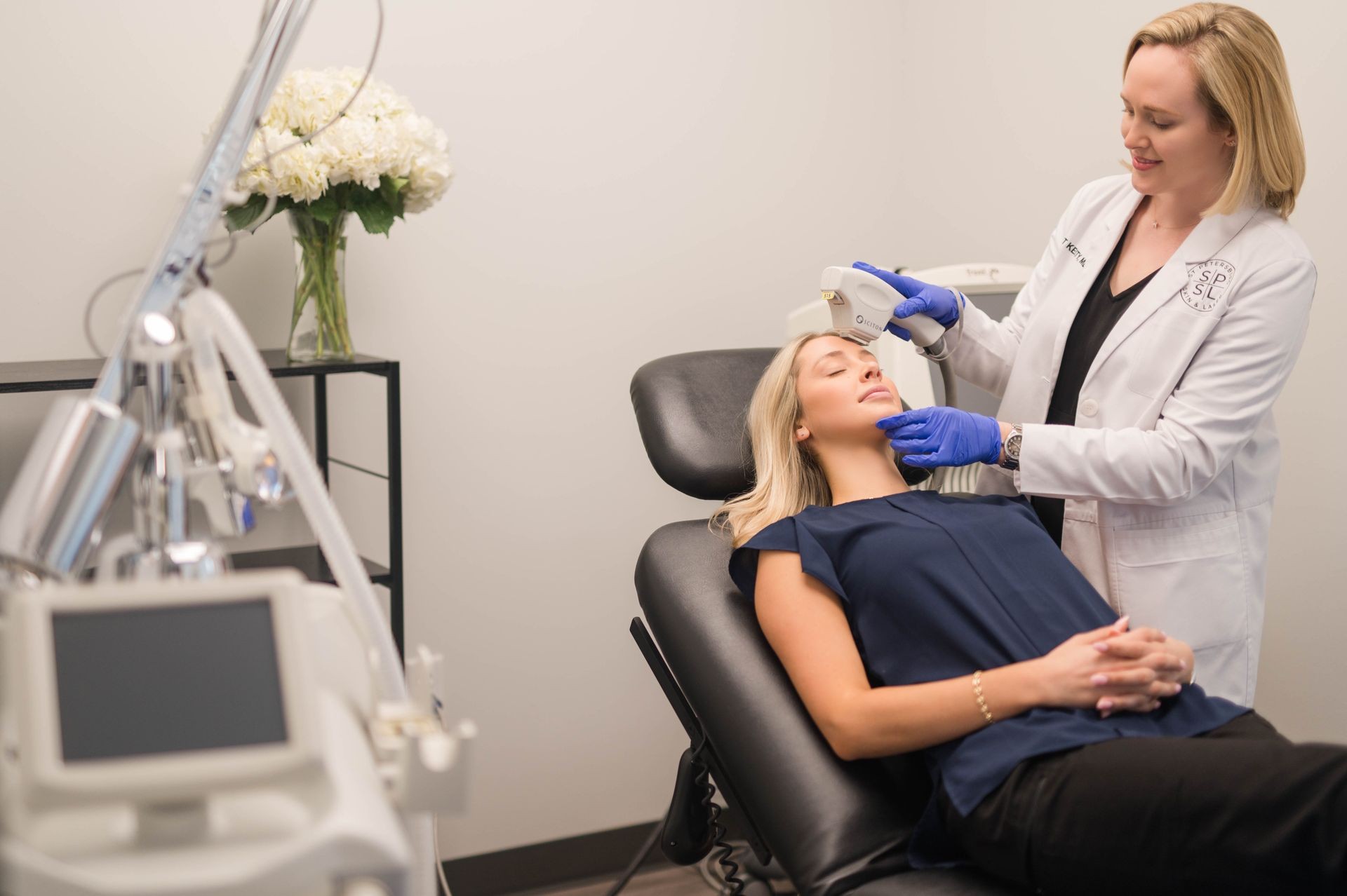 white coat doctor holding a laser